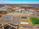 Wide aerial view of the community, with organized sports facilities, ample parking, and green spaces at 114 Marron Dr, Indian Trail, NC 28079