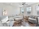 Inviting living room with wood floors, a sectional sofa, and lots of natural light from the windows at 114 Marron Dr, Indian Trail, NC 28079