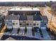 Aerial shot of modern townhomes with private garages and driveways in a vibrant community at 114 Marron Dr, Indian Trail, NC 28079