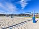 Sand volleyball courts with nets and equipment under a bright blue sky, part of the community amenities at 114 Marron Dr, Indian Trail, NC 28079