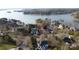 Stunning aerial view showcasing the waterfront property, its proximity to the lake, and mature trees at 115 Union Chapel Dr, Mooresville, NC 28117