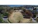Aerial view of a community greenspace and memorial with lush landscaping and surrounding homes at 115 Union Chapel Dr, Mooresville, NC 28117