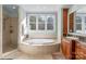 Luxurious bathroom features a soaking tub, separate shower and vanity at 115 Union Chapel Dr, Mooresville, NC 28117