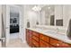 Well-lit bathroom featuring double vanity, modern fixtures, granite counters and neutral-toned walls at 115 Union Chapel Dr, Mooresville, NC 28117