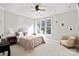Bright bedroom showcasing a large window, neutral tones, and comfortable furnishings, creating a serene atmosphere at 115 Union Chapel Dr, Mooresville, NC 28117