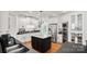 Modern kitchen features stainless steel appliances, marble island and white cabinetry at 115 Union Chapel Dr, Mooresville, NC 28117
