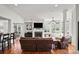 Bright living room features a fireplace, large windows, and hardwood floors at 115 Union Chapel Dr, Mooresville, NC 28117
