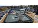 Aerial view of tennis courts, clubhouse, and swimming pool near the lake in a beautiful residential community at 115 Union Chapel Dr, Mooresville, NC 28117