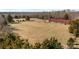 Aerial view of property, including barn and open fields at 11745 Stokes Ferry Rd, Gold Hill, NC 28071