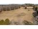 Aerial view of property showing expansive land with barn and tractor at 11745 Stokes Ferry Rd, Gold Hill, NC 28071