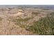 Aerial view of property showcasing woodland and a pond at 11745 Stokes Ferry Rd, Gold Hill, NC 28071