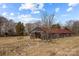 Rustic barn with metal roof, offering storage space at 11745 Stokes Ferry Rd, Gold Hill, NC 28071