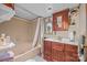 Bathroom with tub, vanity, and neutral color palette at 11745 Stokes Ferry Rd, Gold Hill, NC 28071