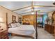 Spacious bedroom with post bed, dresser, and workspace at 11745 Stokes Ferry Rd, Gold Hill, NC 28071