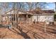 Ranch-style home with a covered porch and fenced yard at 11745 Stokes Ferry Rd, Gold Hill, NC 28071