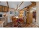 Kitchen with round dining table and wood cabinets at 11745 Stokes Ferry Rd, Gold Hill, NC 28071