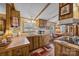 Kitchen with double sink, wood cabinets, and breakfast nook at 11745 Stokes Ferry Rd, Gold Hill, NC 28071