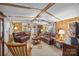 Living room with two leather sofas and a rocking chair at 11745 Stokes Ferry Rd, Gold Hill, NC 28071