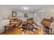 Rustic living room with leather furniture and wood floors at 11745 Stokes Ferry Rd, Gold Hill, NC 28071