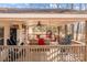 Relaxing covered porch with seating and ceiling fan at 11745 Stokes Ferry Rd, Gold Hill, NC 28071