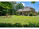 Spacious backyard with a fountain and plenty of green space at 119 Barton Pl, Mooresville, NC 28117