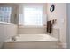 Bathroom with a large garden tub and separate shower at 119 Barton Pl, Mooresville, NC 28117