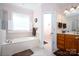 Bathroom features a soaking tub, shower, and double vanity at 119 Barton Pl, Mooresville, NC 28117