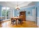 Spacious dining room with hardwood floors, large window and chandelier at 119 Barton Pl, Mooresville, NC 28117