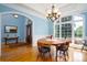 Bright dining room with hardwood floors, hutch, and large window at 119 Barton Pl, Mooresville, NC 28117