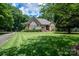 Brick home with manicured lawn and basketball goal at 119 Barton Pl, Mooresville, NC 28117