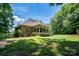 Brick house with a large sunroom and backyard at 119 Barton Pl, Mooresville, NC 28117