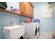 Laundry room with washer, dryer, utility sink, and cabinets at 119 Barton Pl, Mooresville, NC 28117