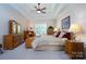 Spacious main bedroom with a king-size bed and wood furnishings at 119 Barton Pl, Mooresville, NC 28117