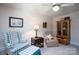 Relaxing sitting room featuring comfy armchairs, a gun cabinet, and a ceiling fan at 119 Barton Pl, Mooresville, NC 28117