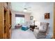 Cozy sitting area with two armchairs, ottoman and built in shelving at 119 Barton Pl, Mooresville, NC 28117