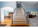 White painted staircase with wooden handrail at 119 Barton Pl, Mooresville, NC 28117