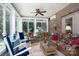 Comfortable sunroom, featuring wicker furniture and ceiling fan at 119 Barton Pl, Mooresville, NC 28117