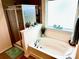 Relaxing bathroom showcasing a soaking tub, glass-enclosed shower, and modern finishes at 121 Mackinac Dr, Mooresville, NC 28117