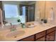 Bright bathroom with double sinks, modern fixtures, and a luxurious soaking tub for a spa-like experience at 121 Mackinac Dr, Mooresville, NC 28117