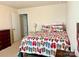 Bright bedroom with flip flop themed bedspread, carpet flooring, and neutral wall colors at 121 Mackinac Dr, Mooresville, NC 28117
