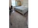 This bedroom features neutral carpet, a desk, and a large wardrobe for ample storage at 121 Mackinac Dr, Mooresville, NC 28117