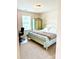 Comfortable bedroom with floral patterned accent furniture and ample natural light at 121 Mackinac Dr, Mooresville, NC 28117