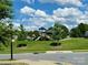 A view of the neighborhood playground on a sunny day with blue skies and trees surrounding at 121 Mackinac Dr, Mooresville, NC 28117