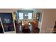 Elegant dining room featuring a wooden table, seating for six, and a display cabinet at 121 Mackinac Dr, Mooresville, NC 28117