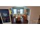 Traditional dining room featuring hardwood floors, a wooden table, and elegant china cabinet at 121 Mackinac Dr, Mooresville, NC 28117