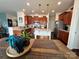 A bright kitchen boasts granite countertops, stainless steel appliances and an island at 121 Mackinac Dr, Mooresville, NC 28117
