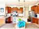 Well-equipped kitchen with stainless steel appliances, granite countertops, and central island at 121 Mackinac Dr, Mooresville, NC 28117