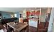 Open-concept kitchen with stainless steel appliances, granite countertops, and a view into the living room at 121 Mackinac Dr, Mooresville, NC 28117