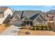 Aerial view of a house with a two-car garage and manicured lawn at 12904 Vermillion Xing, Huntersville, NC 28078