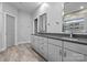 Bathroom with double vanity and gray cabinets at 12904 Vermillion Xing, Huntersville, NC 28078